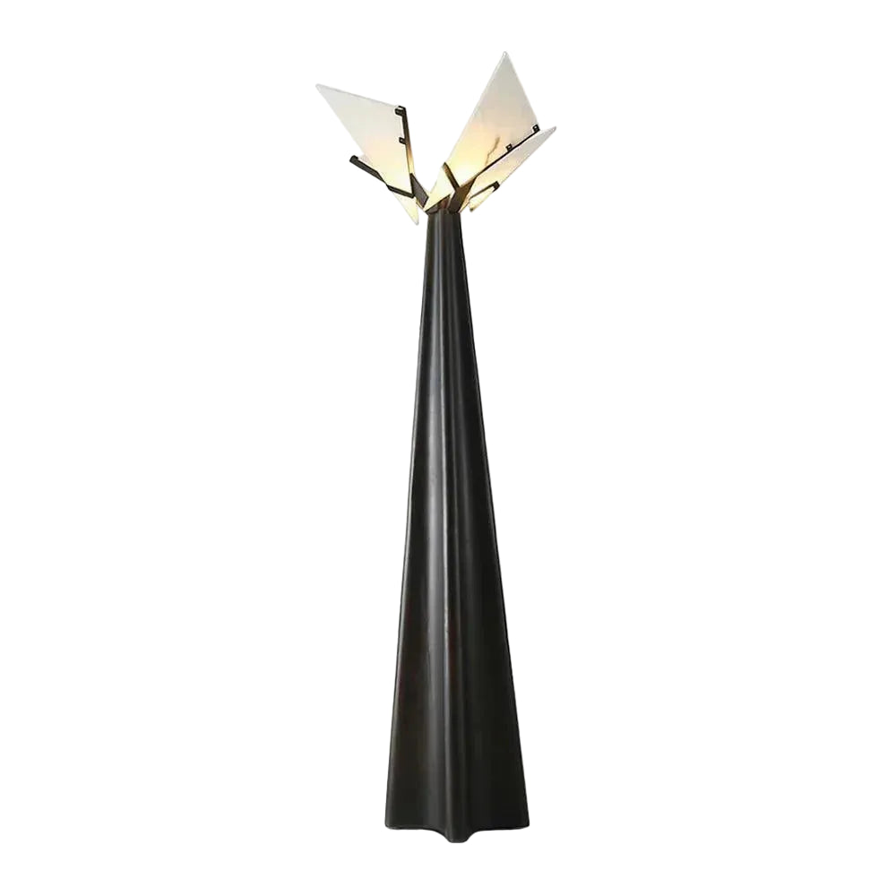 Modern floor lamp with black base and white shade on a white background