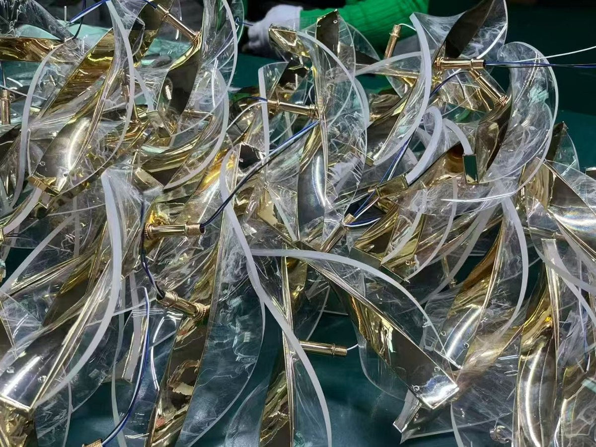 Gold and clear lighting components organized before assembly