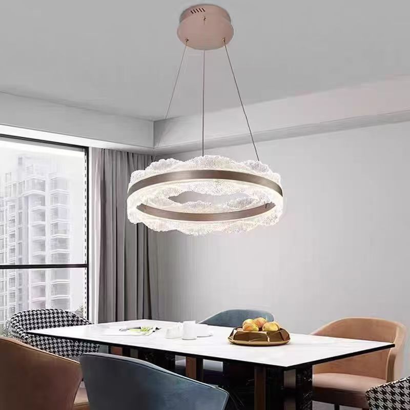 Illuminated crystal pendant above a dining table